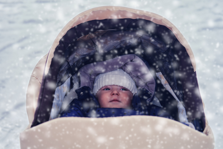 How To Protect Baby From Extreme Cold, Baby Bundled Up Looking Outside At Snow